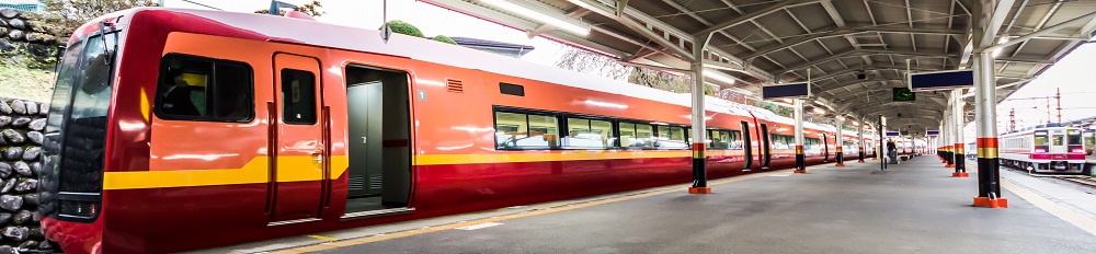 red train and railroad platform in japan